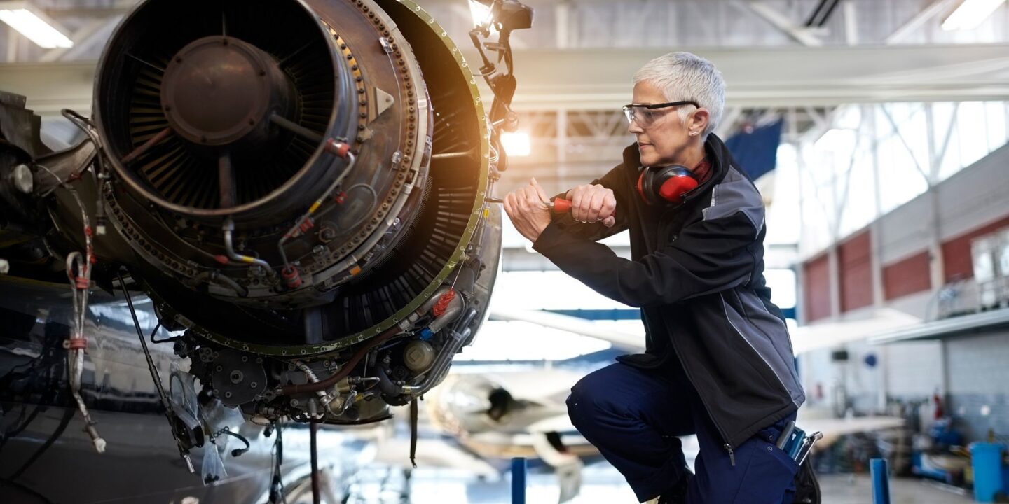 Female engineer maintaining airplane jet engine - Clarifying AS9100 8.4.3 and Flow Downs to External Providers