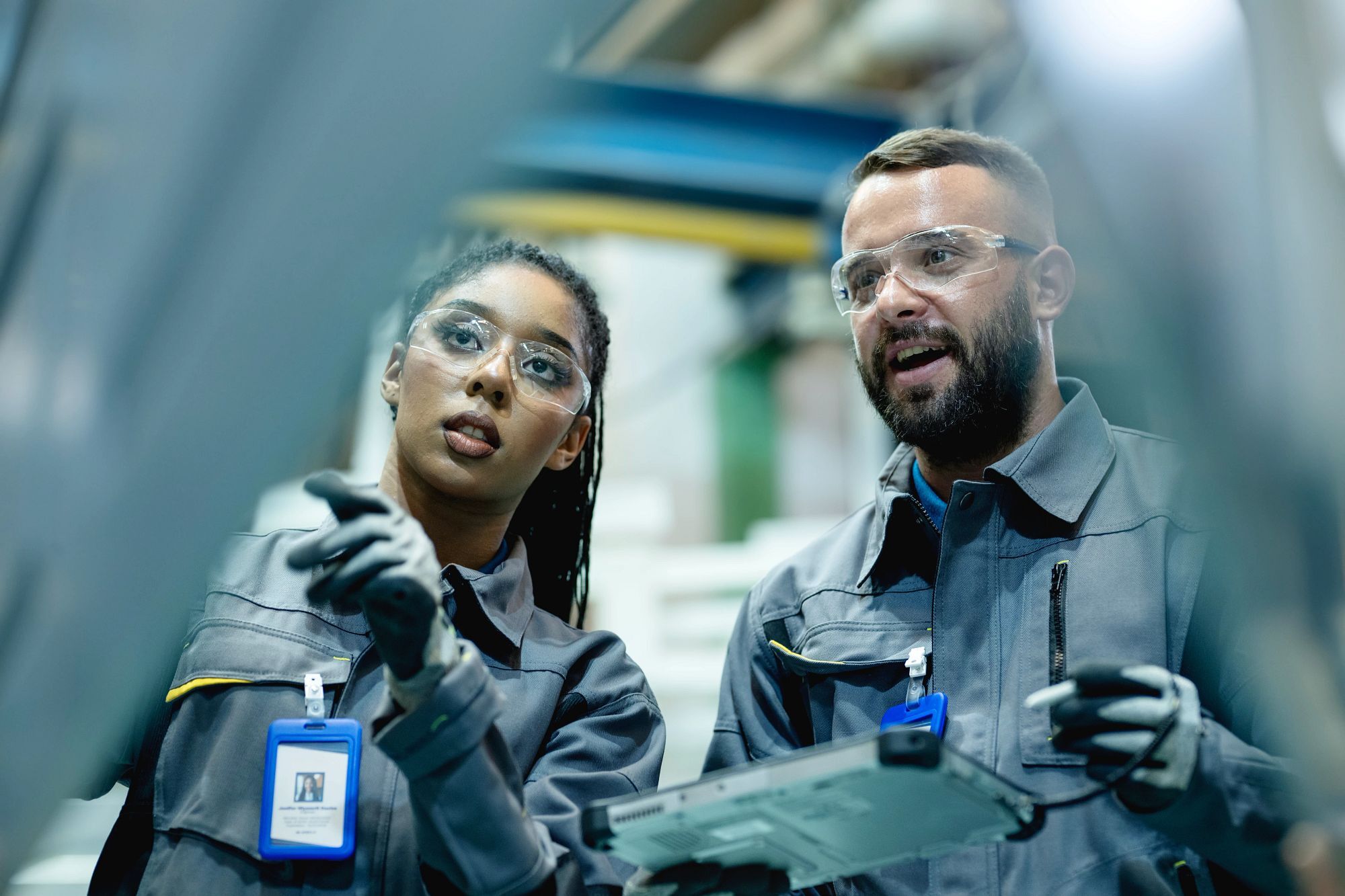 Use technology to improve manufacturing processes and help produce high-quality products in manufacturing industry. A team of production and planing control engineer analyzing an engineering product to improve production process in he production line floor.