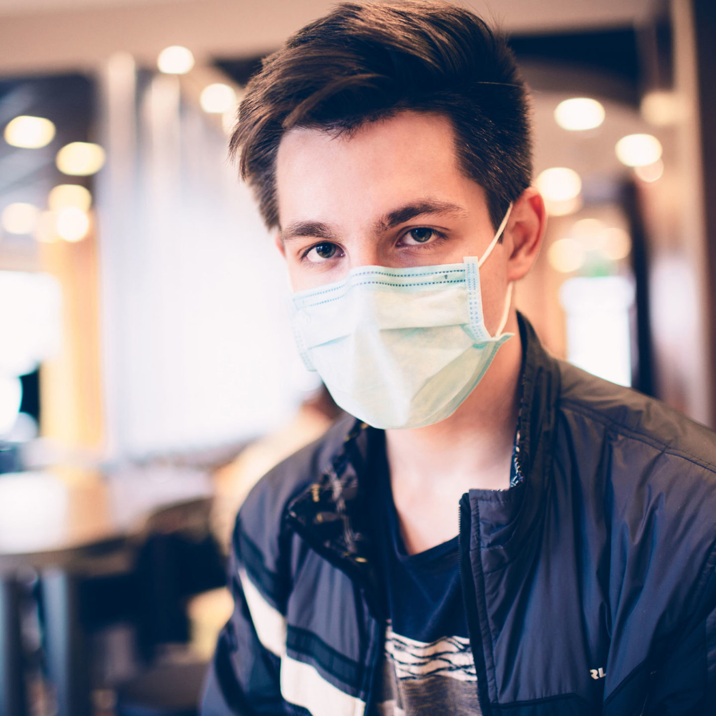 Male customer in a restaurant wearing a face mask