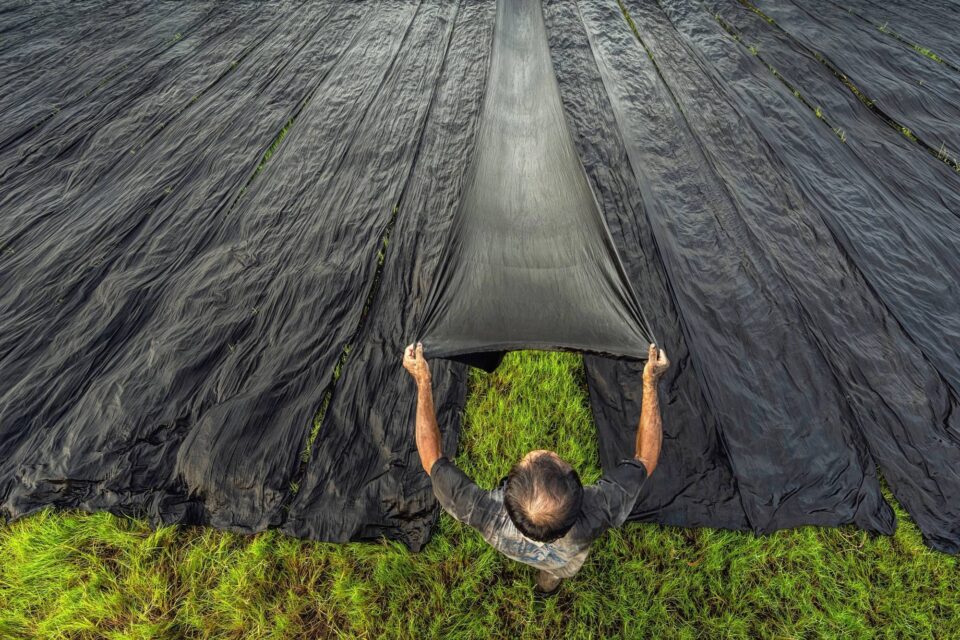 Worker drying clothes ethical audits tool 181291881