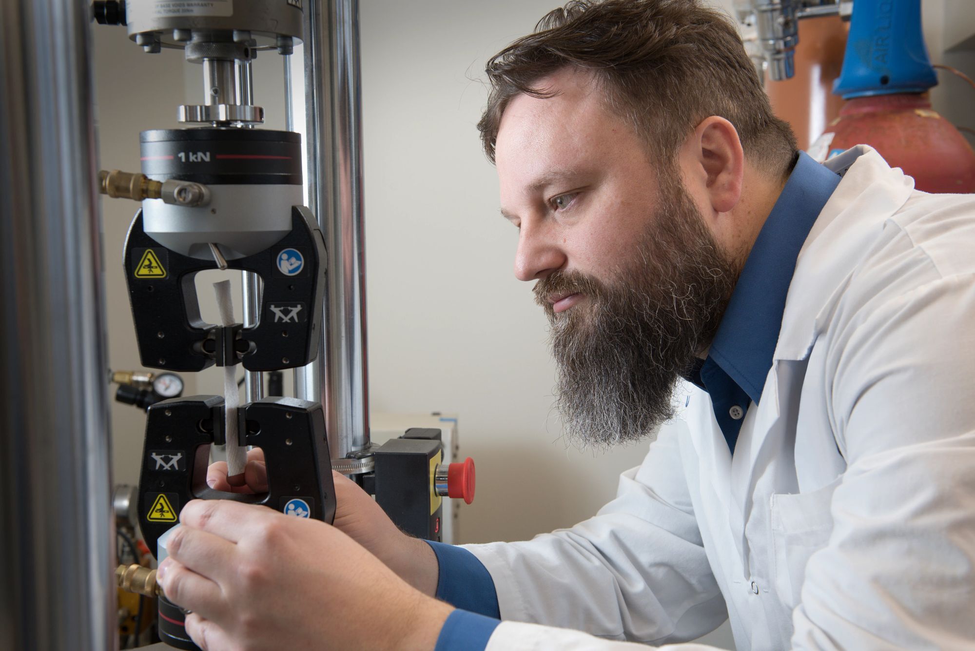 NSF employee using lab equipment in an NSF laboratory - Celebrating 80 Years of Improving Human and Planet Health | NSF